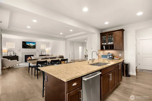 a kitchen that has a sink and a stove in it