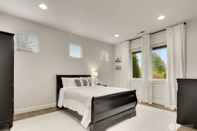 a bedroom with a bed and a cabinets