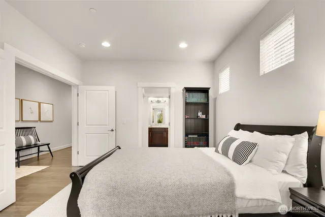 a bathroom with a granite countertop sink toilet and a mirror