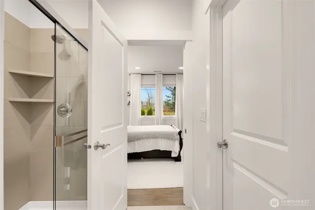 a bedroom with a bed and window