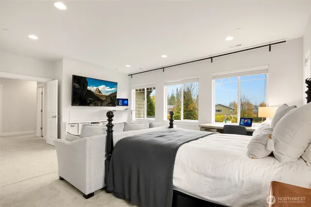 a bedroom with a bed and a window with outer view