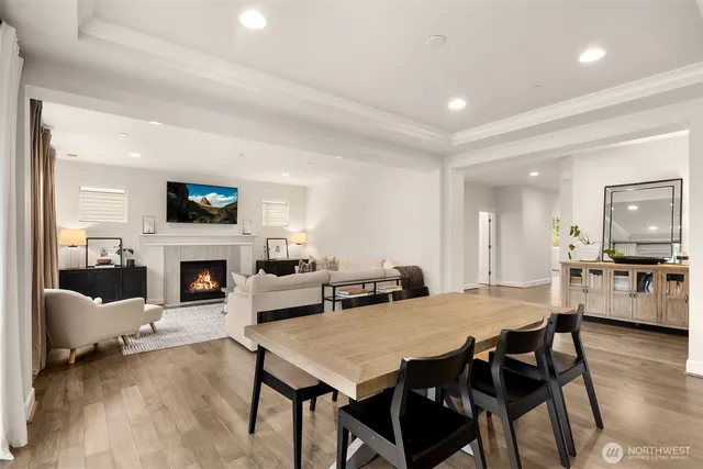 a view of a dining room with furniture and a fireplace