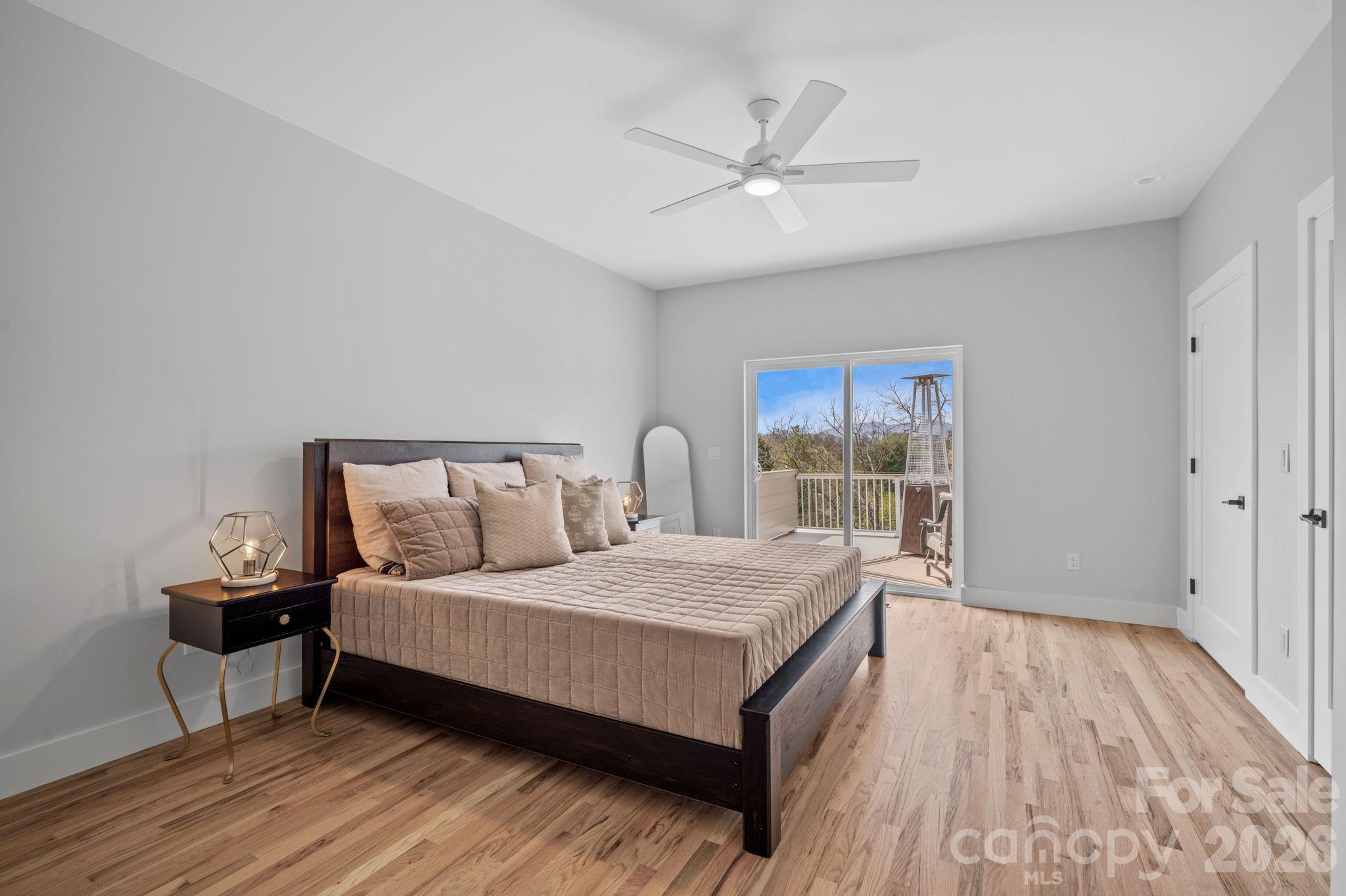 9 Gudger Road Asheville, NC 28715 - Photo 22 of 43 a bedroom with a bed and window