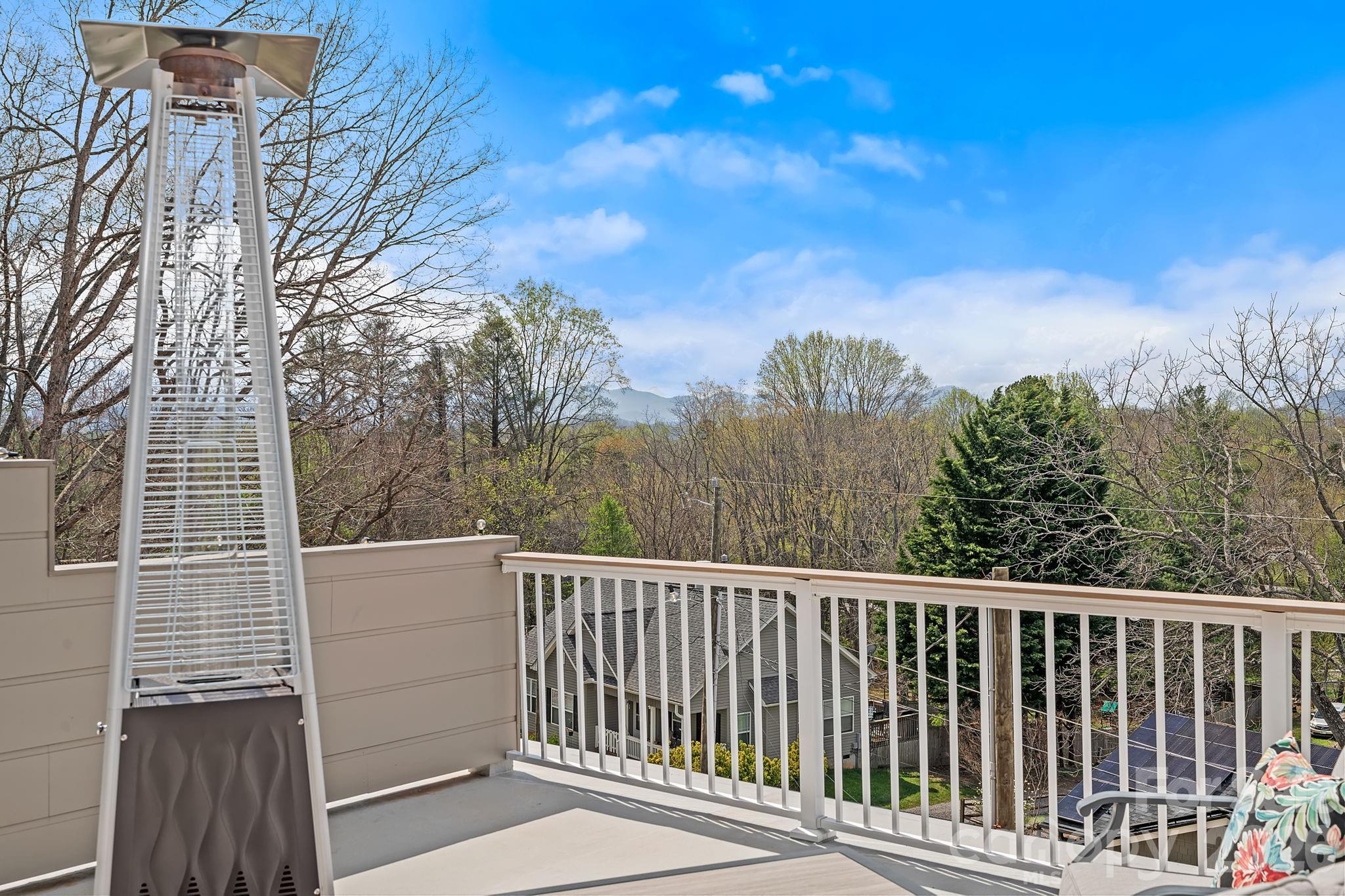 9 Gudger Road Asheville, NC 28715 - Photo 25 of 43 a view of a roof deck with wooden fence and wooden floor