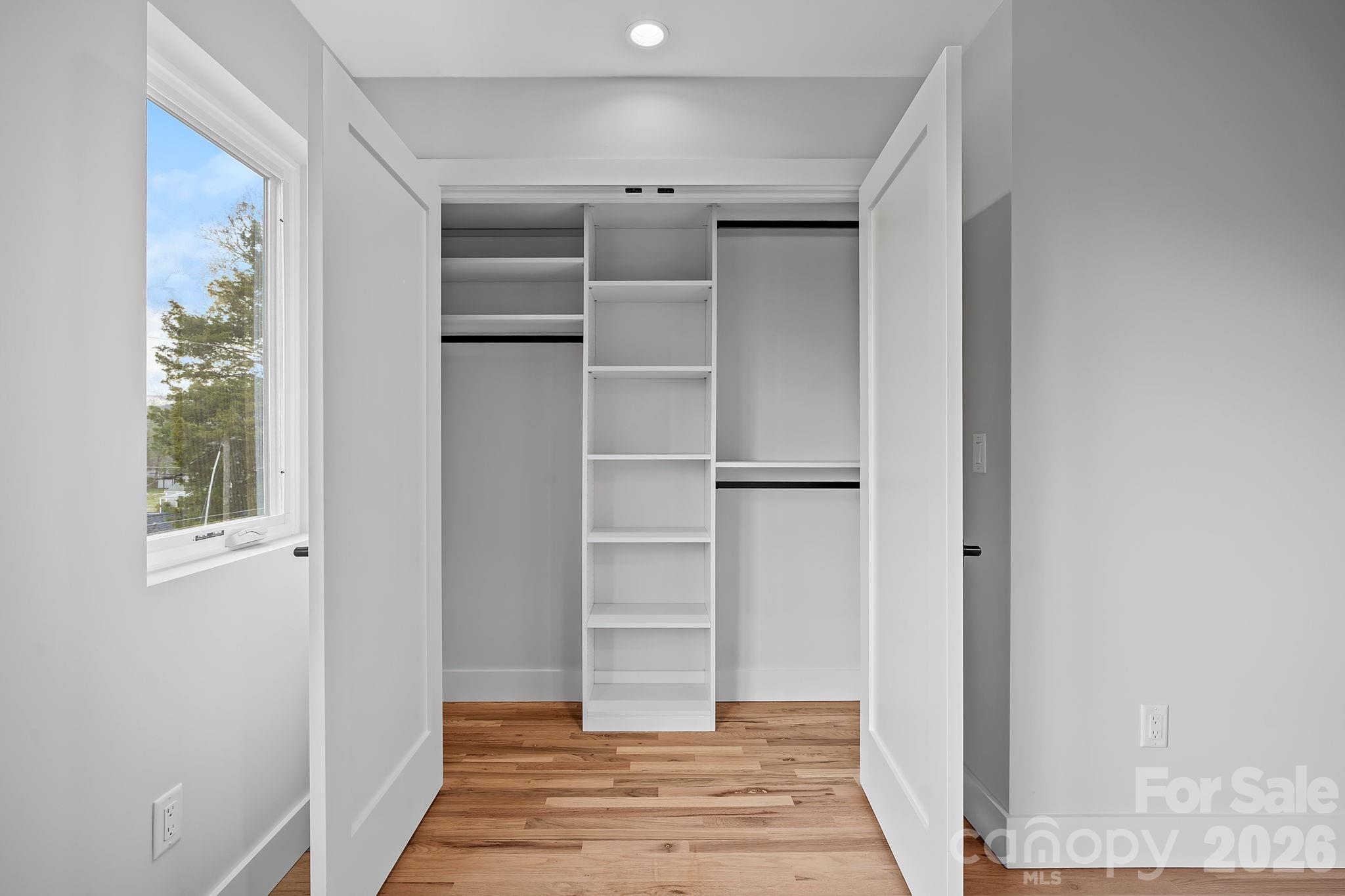 9 Gudger Road Asheville, NC 28715 - Photo 34 of 43 a room with walk in closet and window