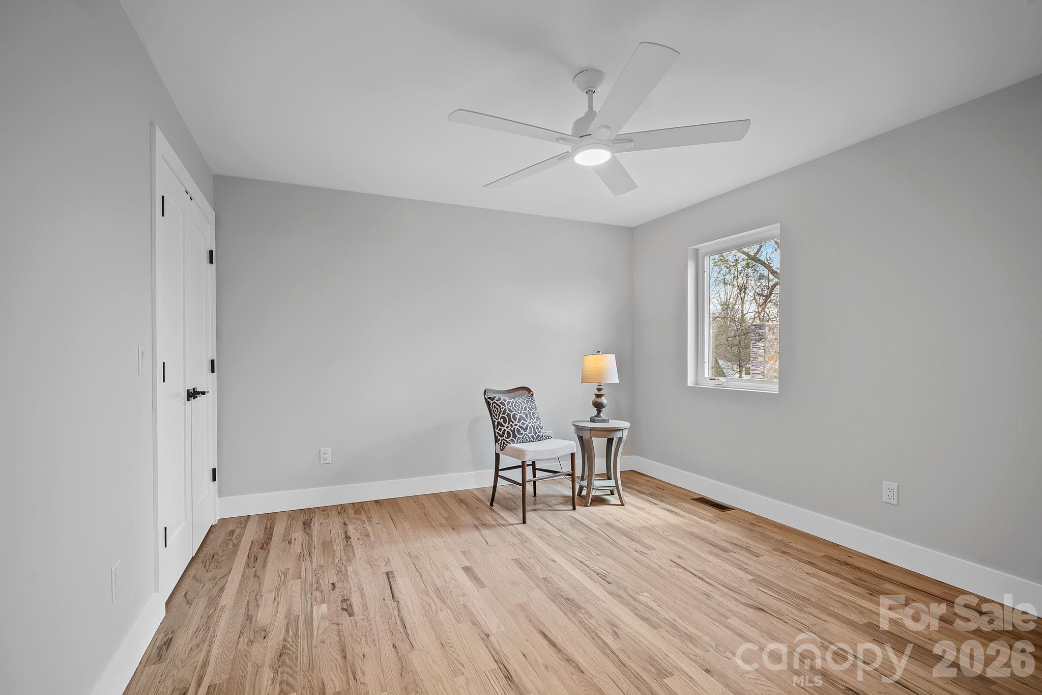 9 Gudger Road Asheville, NC 28715 - Photo 36 of 43 a view of a room with wooden floor lounge chair and windows