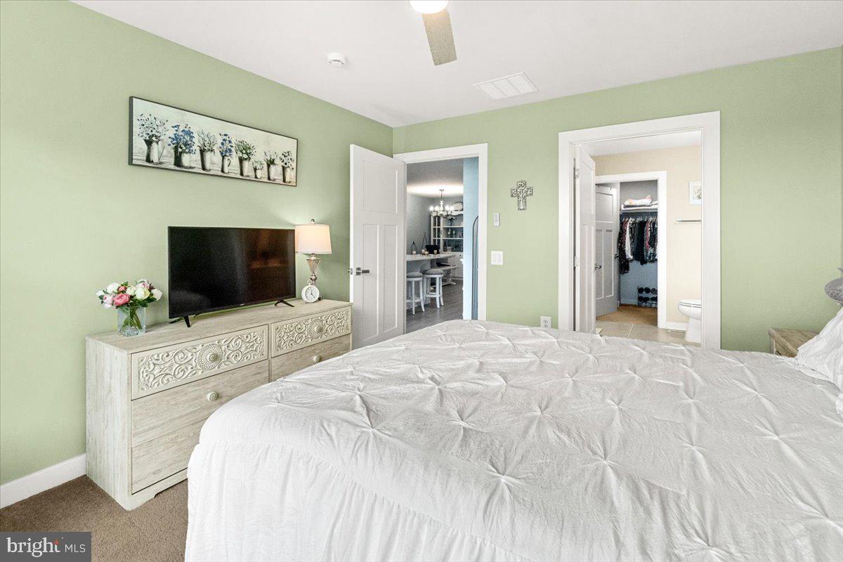 312 Hammersmith Circle Frederick, MD 21702 - Photo 15 of 41 a bedroom with a bed and a flat screen tv