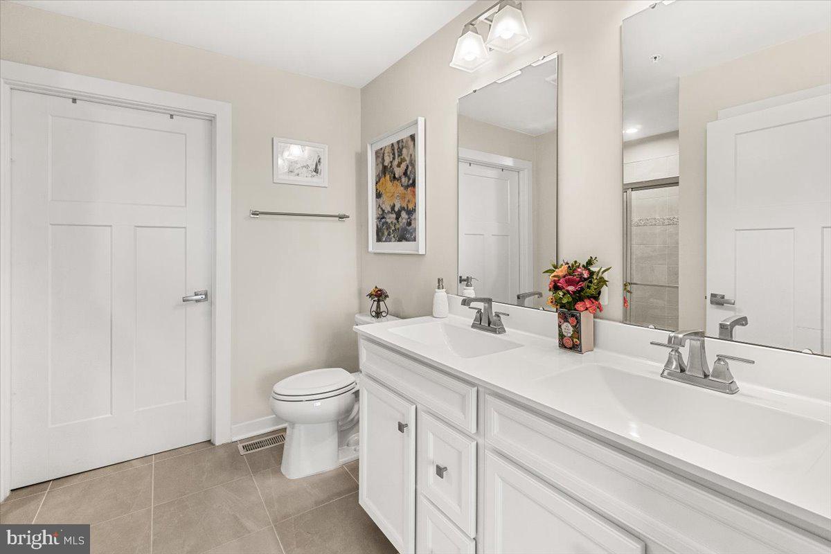 312 Hammersmith Circle Frederick, MD 21702 - Photo 16 of 41 a bathroom with a sink toilet and a mirror