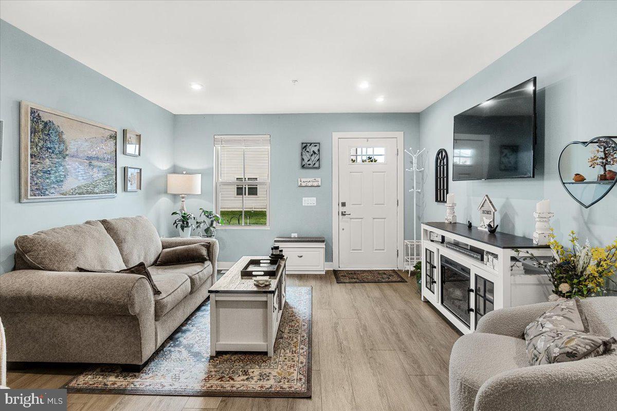 312 Hammersmith Circle Frederick, MD 21702 - Photo 3 of 41 a living room with furniture and a flat screen tv