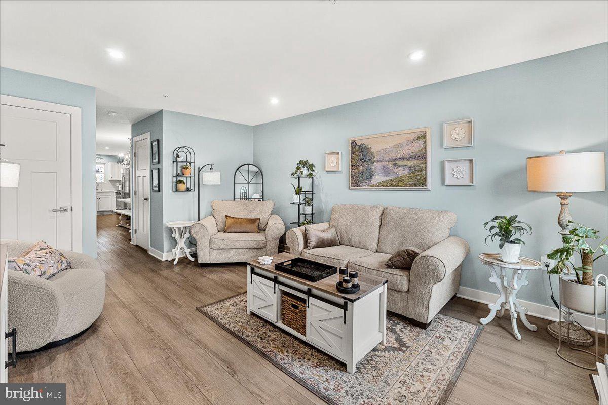 312 Hammersmith Circle Frederick, MD 21702 - Photo 4 of 41 a living room with furniture and wooden floor
