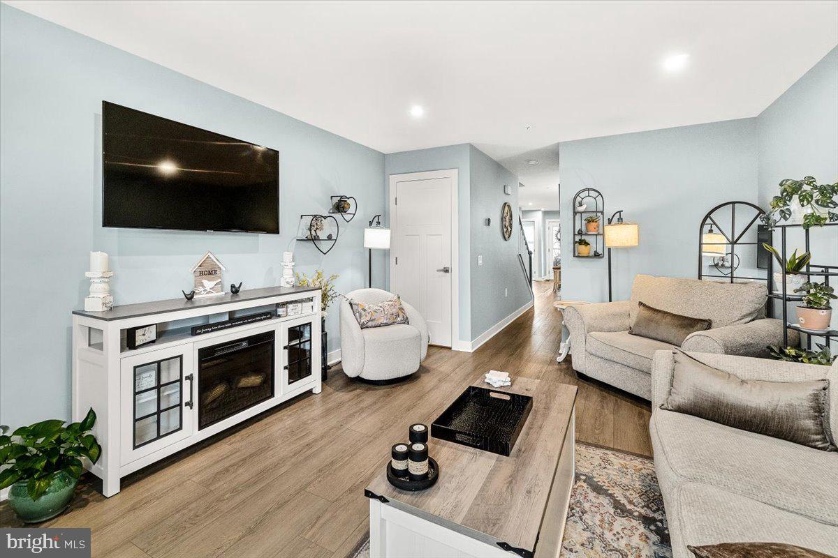 312 Hammersmith Circle Frederick, MD 21702 - Photo 5 of 41 a living room with furniture and a flat screen tv