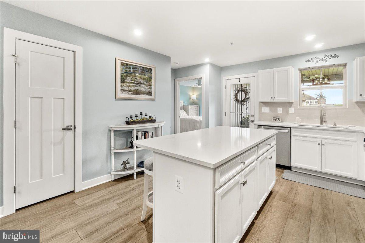 312 Hammersmith Circle Frederick, MD 21702 - Photo 8 of 41 a kitchen with cabinets and wooden floor