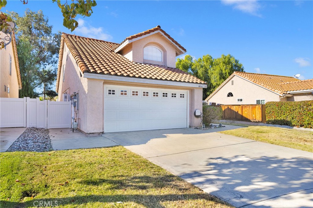40243 Mimulus Way Temecula, CA 92591 - Photo 2 of 33 a front view of a house with garden