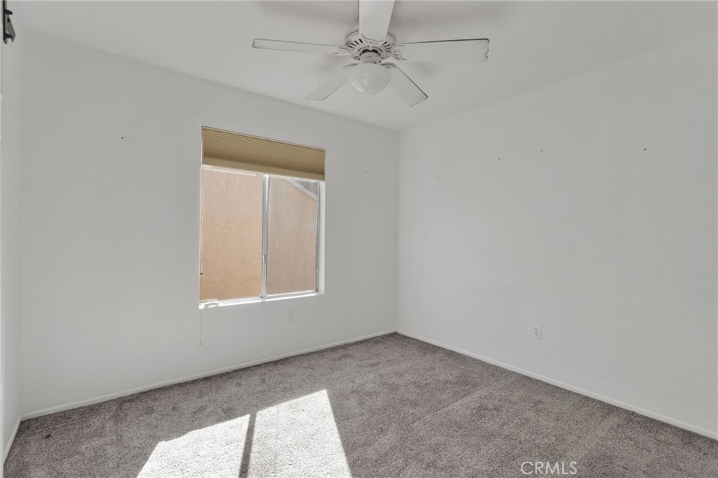 40243 Mimulus Way Temecula, CA 92591 - Photo 22 of 33 an empty room with windows and fan