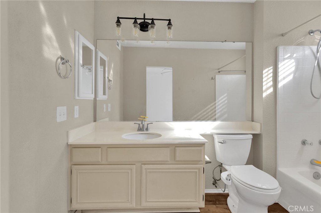 40243 Mimulus Way Temecula, CA 92591 - Photo 25 of 33 a bathroom with a granite countertop toilet sink and mirror