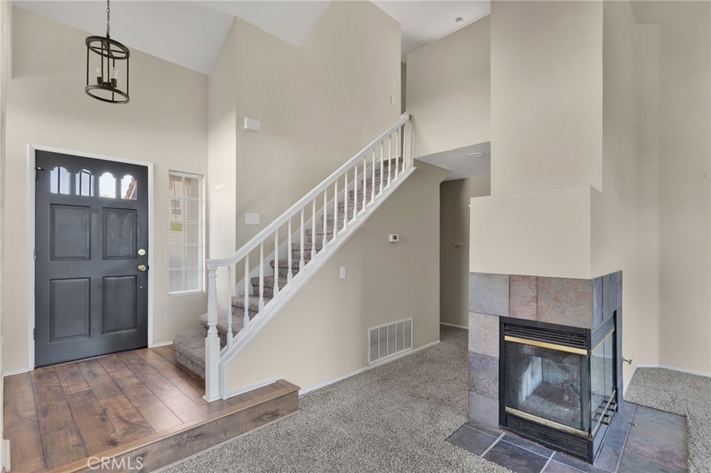 40243 Mimulus Way Temecula, CA 92591 - Photo 7 of 33 a view of an entryway and livingroom with hallway