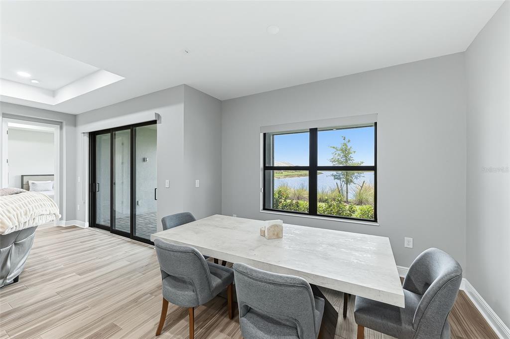 4191 Pegasus Way Naples, FL 34120 - Photo 15 of 48 a view of a dining room with a table and chairs