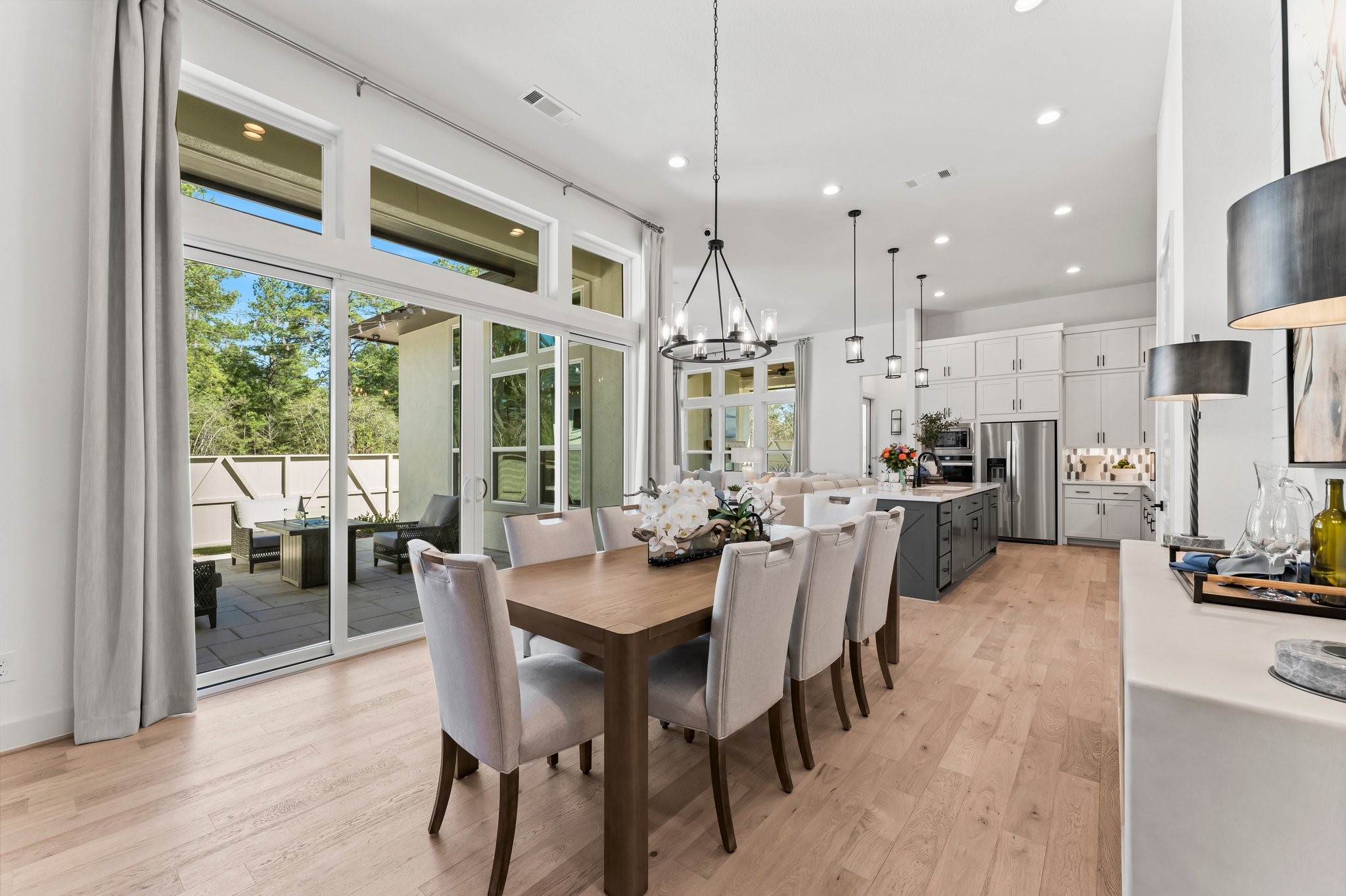 322 Marsh Wren Way Magnolia, TX 77354 - Photo 6 of 19 a view of a dining room with furniture window and wooden floor