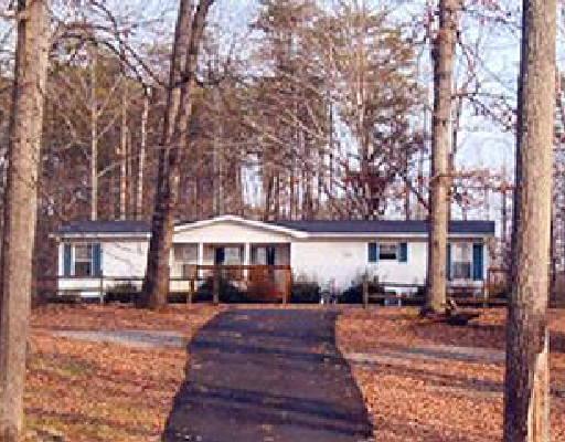 3008 Morgans Mill Road Goodview, VA 24095 - Photo 1 of 1 a view of house with yard and outdoor seating