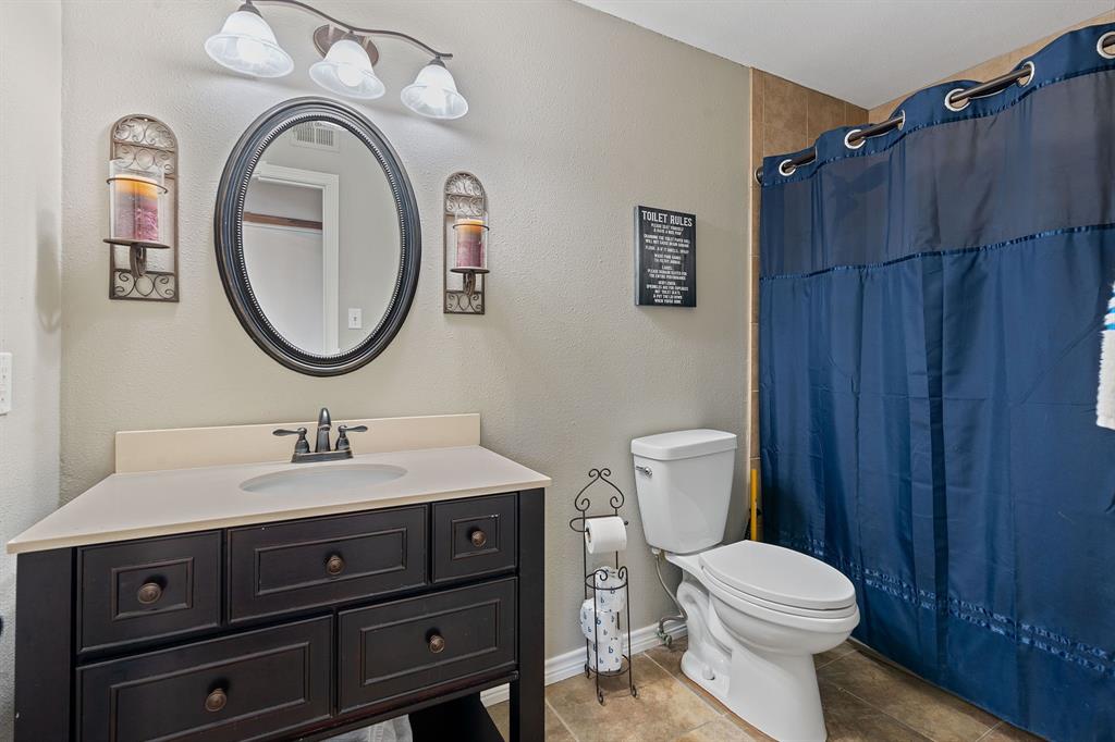 321 Venture Boulevard South Leander, TX 78645 - Photo 11 of 23 Bathroom with vanity and curtained shower
