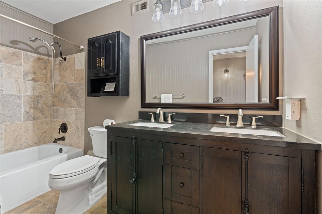 321 Venture Boulevard South Leander, TX 78645 - Photo 13 of 23 Bathroom featuring double vanity and shower / bathtub combination