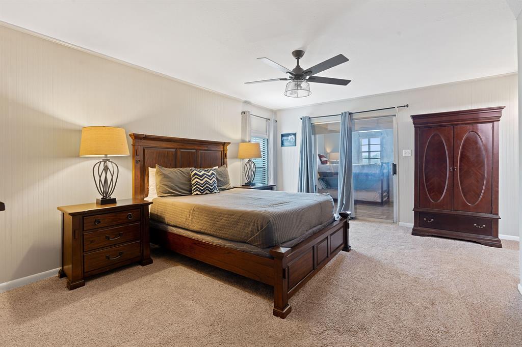 321 Venture Boulevard South Leander, TX 78645 - Photo 9 of 23 Bedroom with light colored carpet, access to exterior, and ceiling fan