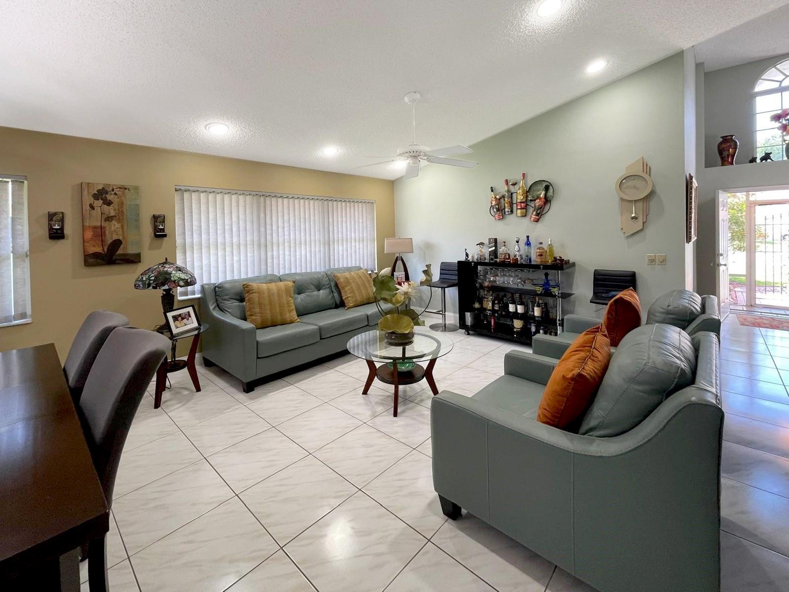 11088 Rios Road Boca Raton, FL 33498 - Photo 5 of 37 a living room with furniture and wooden floor