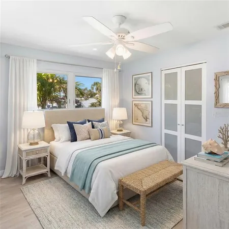 a bedroom with a large bed and a window