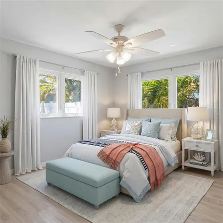 a bedroom with a bed and chandelier