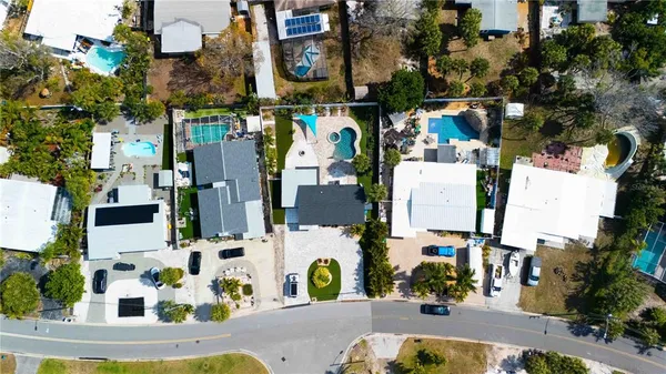 an aerial view of residential houses with outdoor space