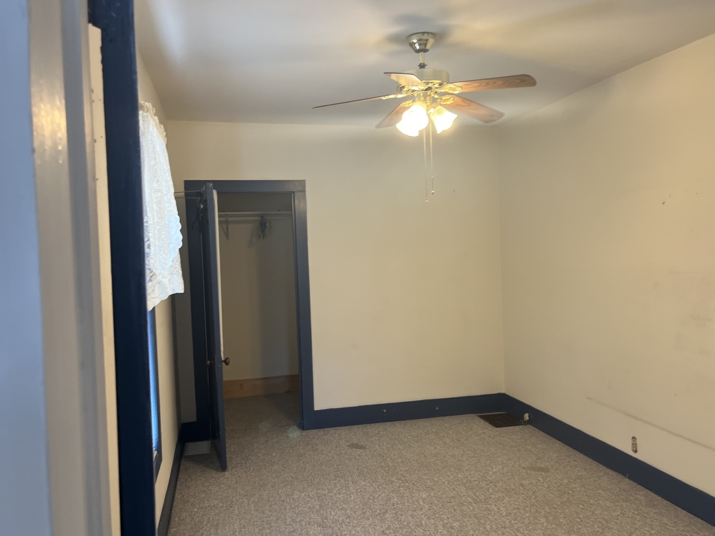 722 North 3rd Street Rochelle, IL 61068 - Photo 8 of 19 a view of an empty room and chandelier fan