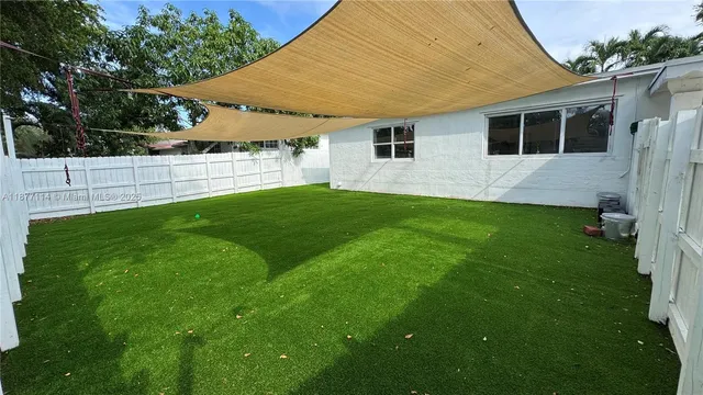 a house view with a garden space