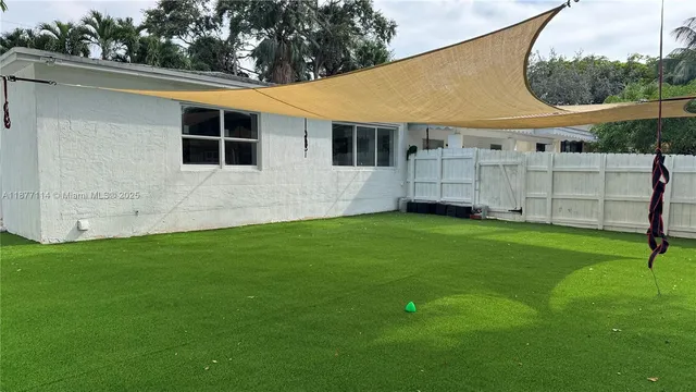 a view of a backyard with a small cabin