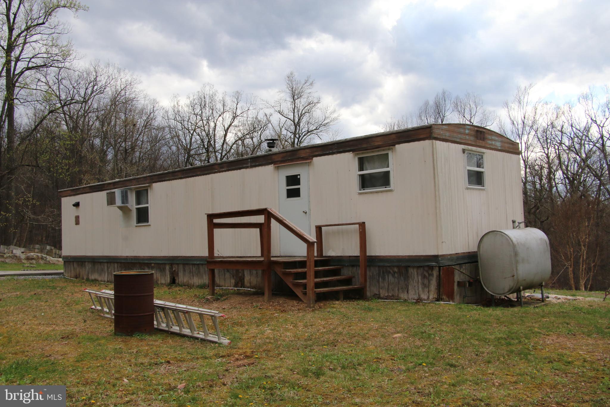 680 Sawlog Road Gore, VA 22637 - Photo 11 of 47 a white house that has tree in front of it