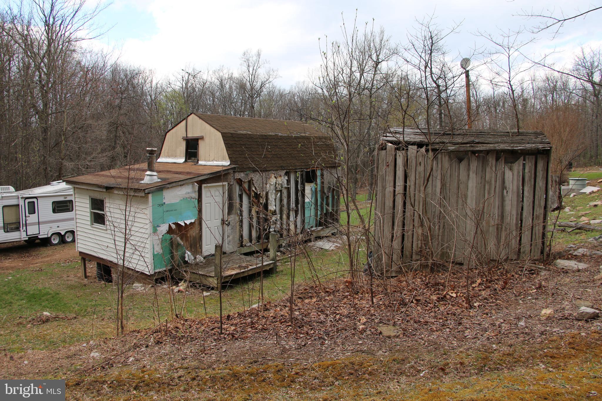 680 Sawlog Road Gore, VA 22637 - Photo 18 of 47 a view of a small house with a yard
