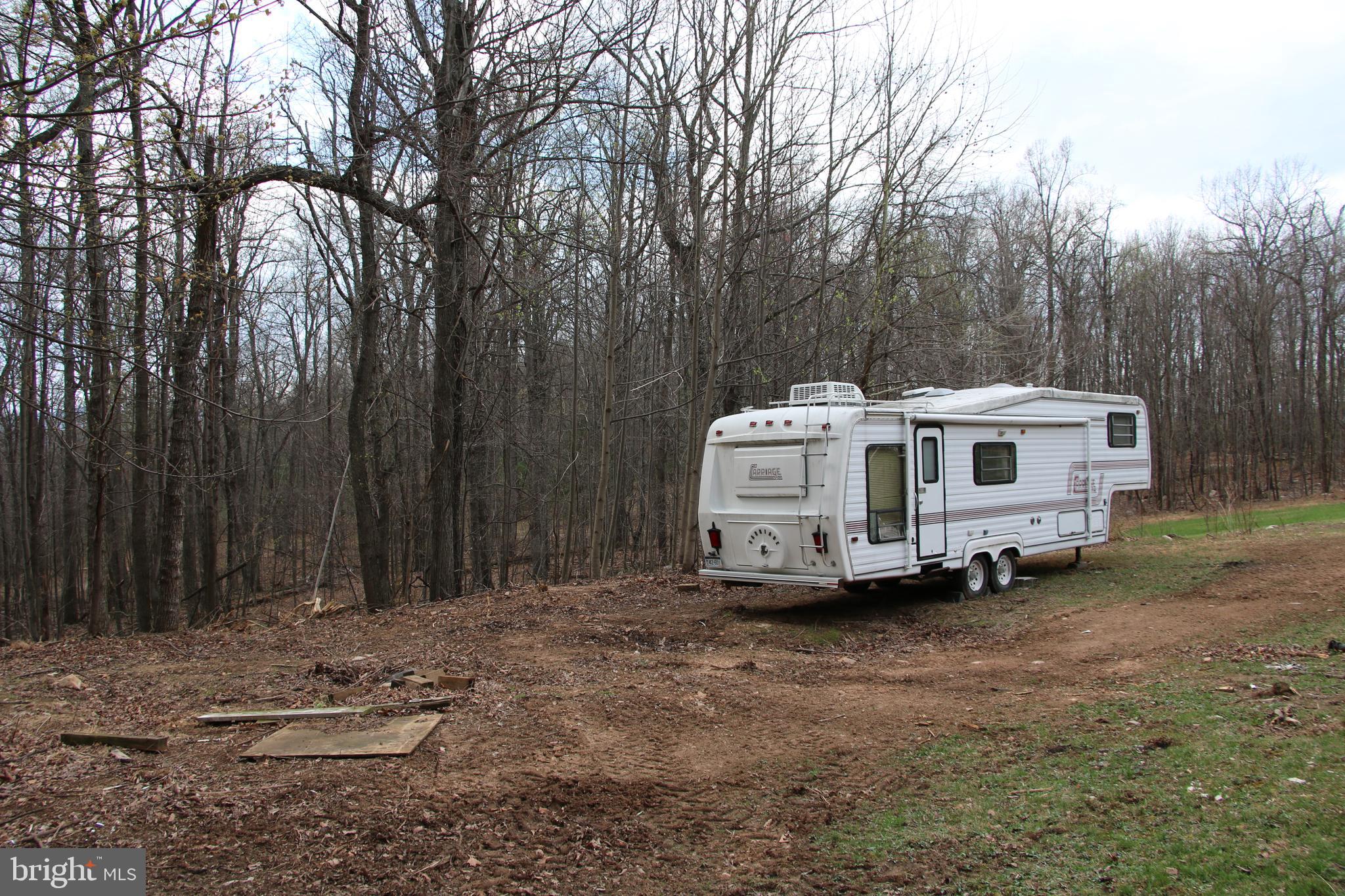 680 Sawlog Road Gore, VA 22637 - Photo 19 of 47 a view of a white house in a yard with large trees