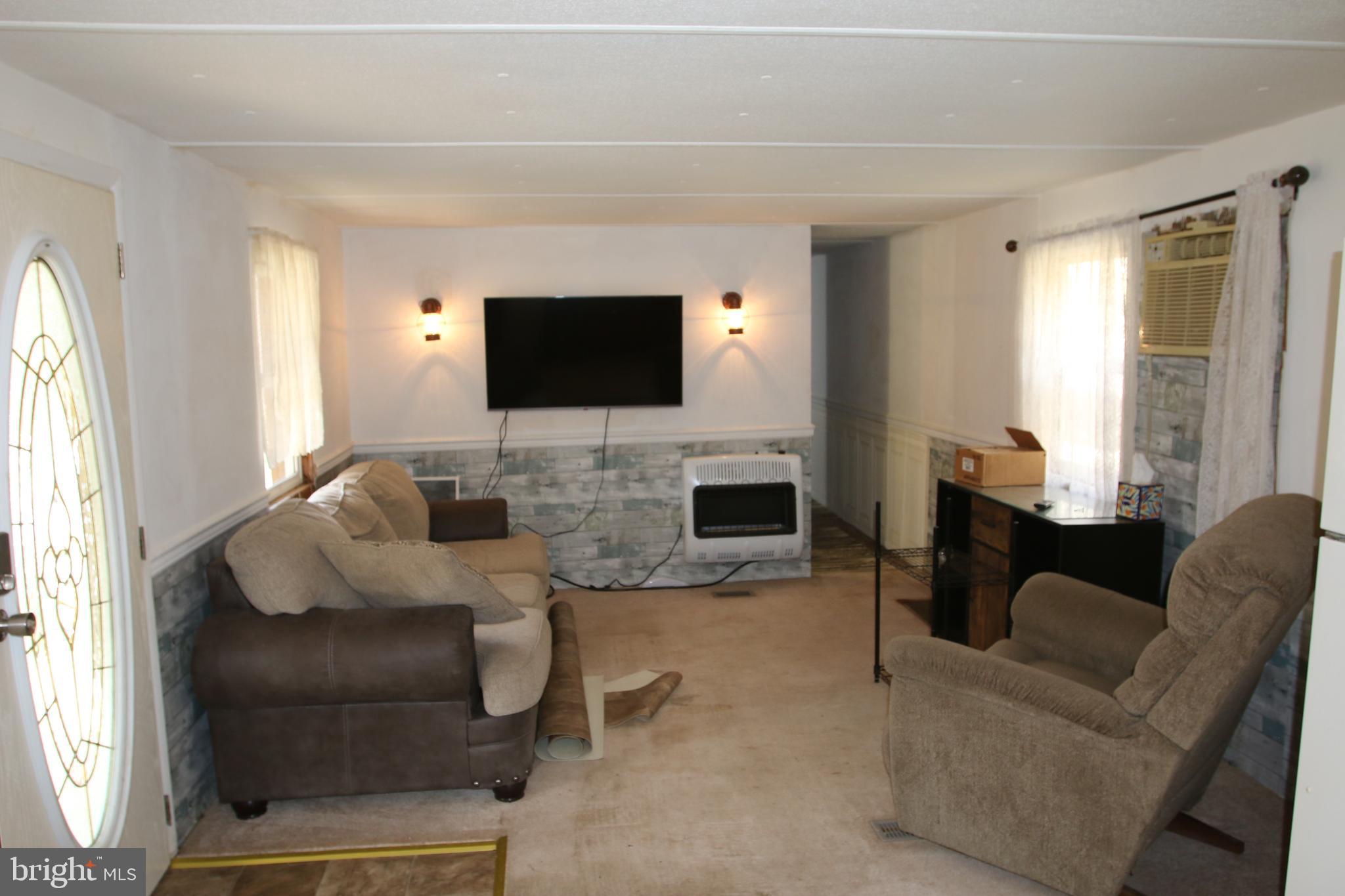 680 Sawlog Road Gore, VA 22637 - Photo 20 of 47 a living room with furniture and a flat screen tv
