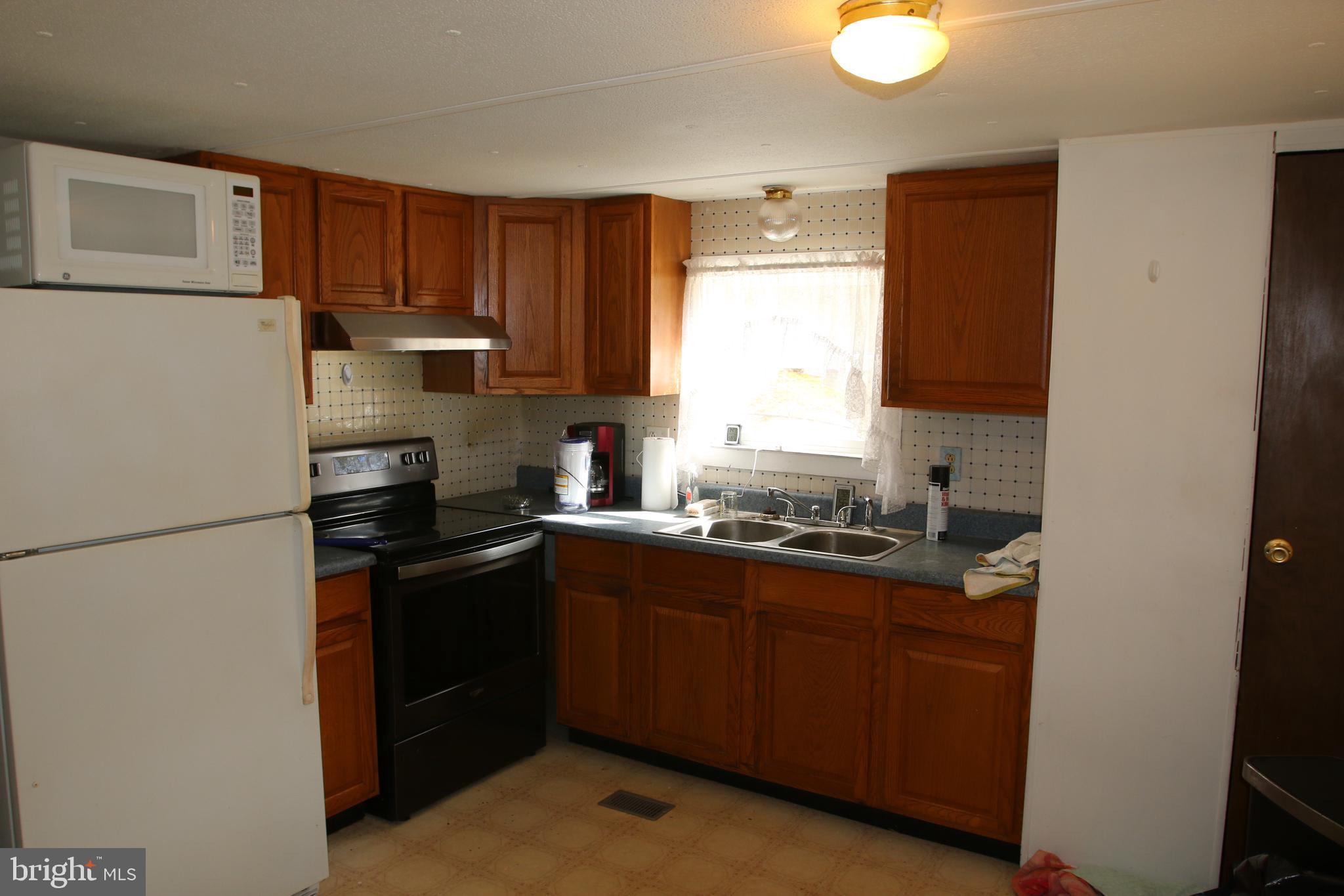 680 Sawlog Road Gore, VA 22637 - Photo 21 of 47 a kitchen with a refrigerator stove and sink