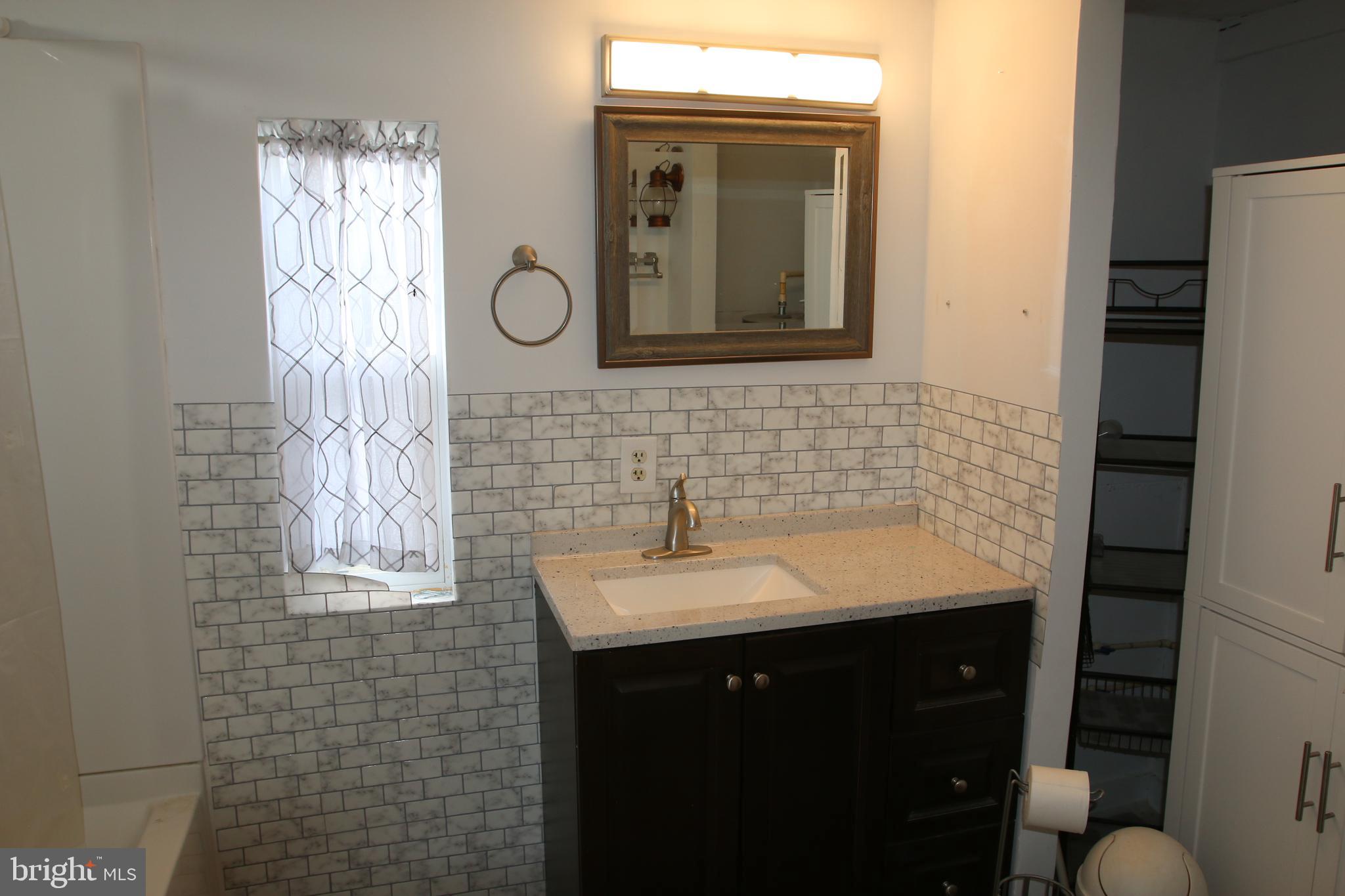 680 Sawlog Road Gore, VA 22637 - Photo 24 of 47 a bathroom with a sink a toilet and mirror