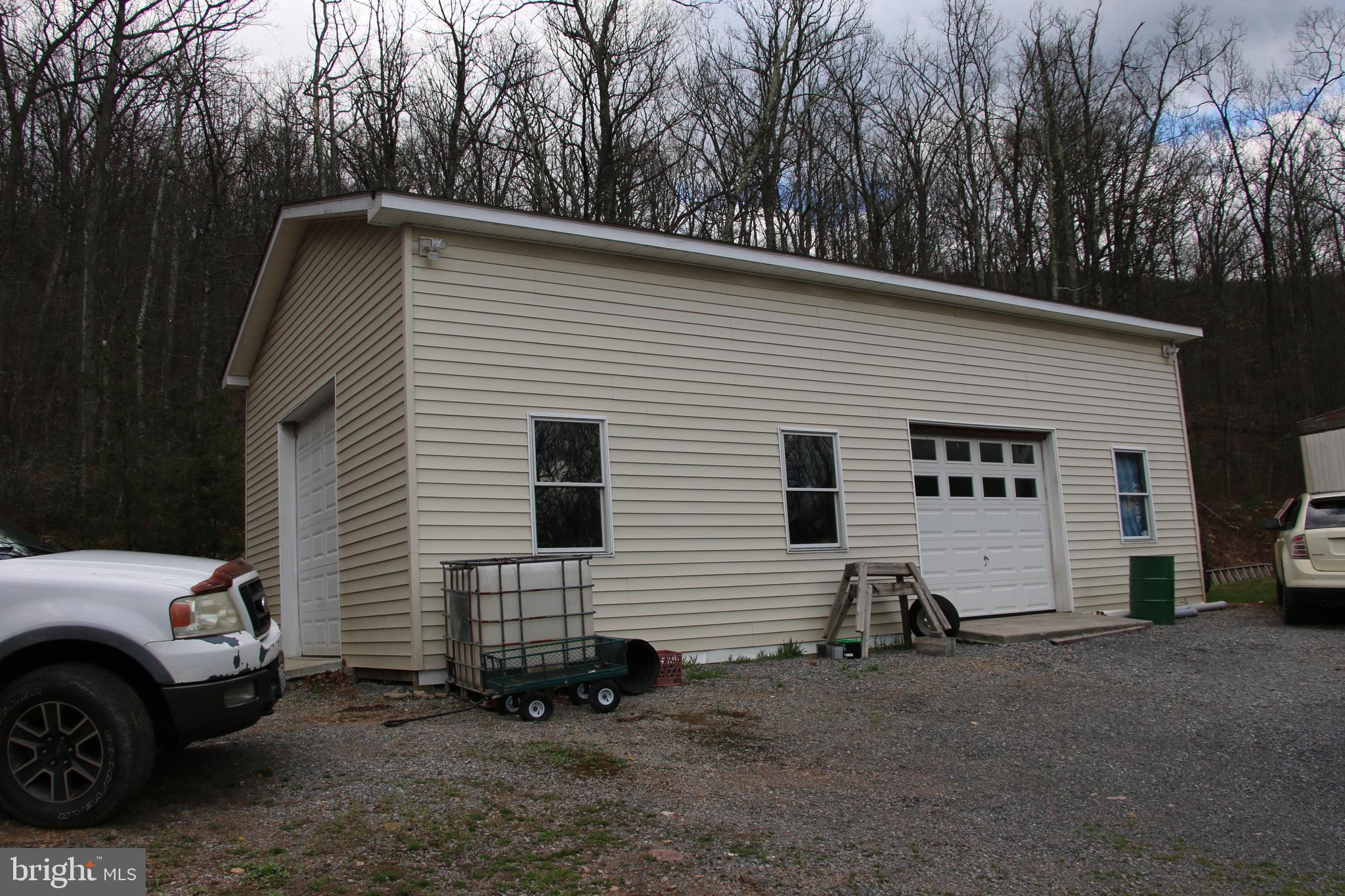 680 Sawlog Road Gore, VA 22637 - Photo 5 of 47 a view of a house with a yard and garage
