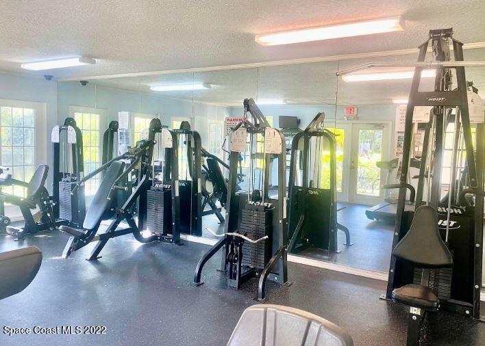 7667 North Wickham Road, Unit 715 Melbourne, FL 32940 - Photo 5 of 13 a view of a room with gym equipment