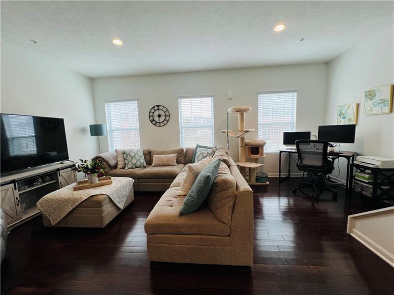 108 Watson Drive Warrendale, PA 15086 - Photo 15 of 31 a living room with furniture and a flat screen tv
