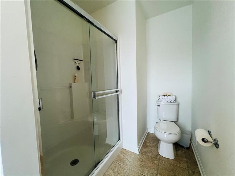108 Watson Drive Warrendale, PA 15086 - Photo 21 of 31 a bathroom with a toilet and a shower
