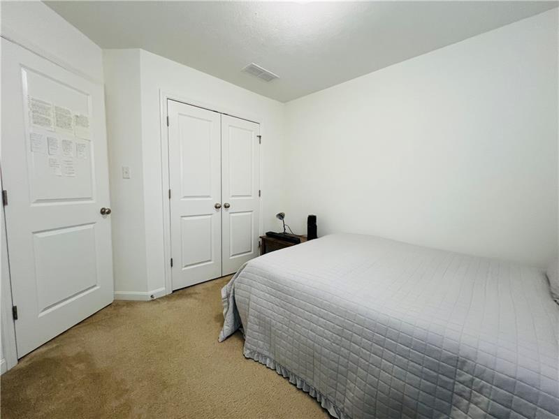 108 Watson Drive Warrendale, PA 15086 - Photo 24 of 31 a bedroom with a bed and cabinets