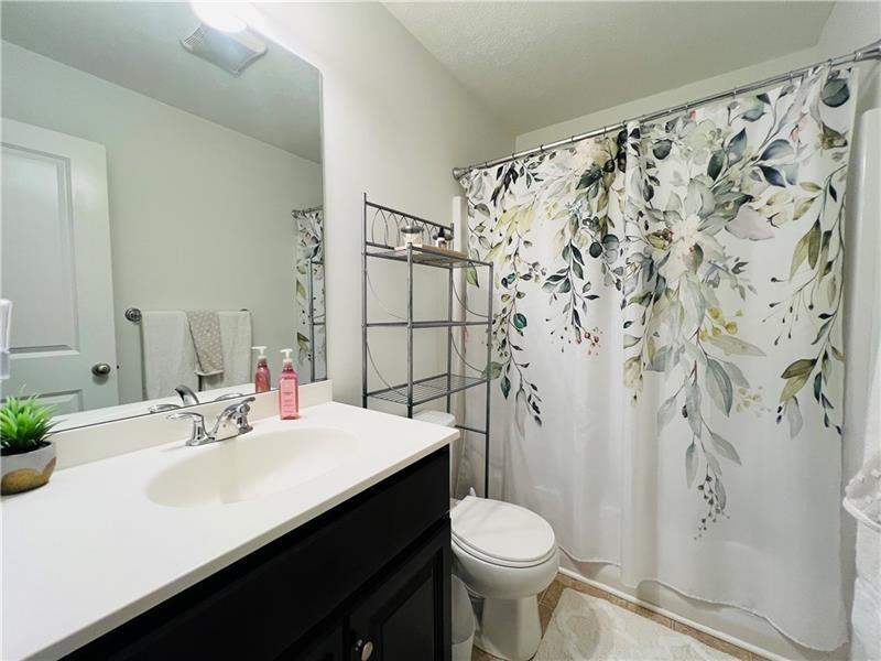 108 Watson Drive Warrendale, PA 15086 - Photo 26 of 31 a bathroom with a sink and a mirror