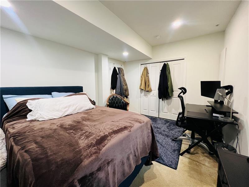 108 Watson Drive Warrendale, PA 15086 - Photo 4 of 31 a bedroom with a bed and wooden floor