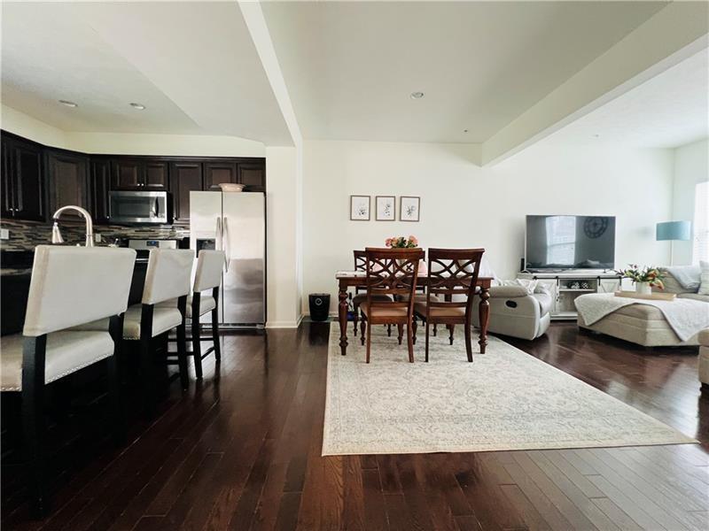 108 Watson Drive Warrendale, PA 15086 - Photo 9 of 31 a living room with furniture and a wooden floor