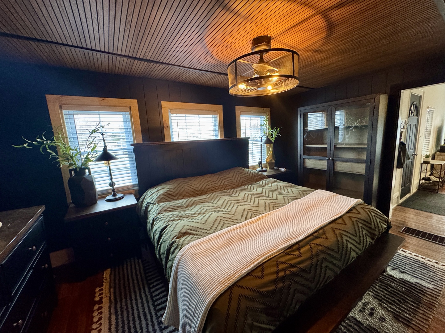 108 West Washington Street Dover, IL 61323 - Photo 17 of 28 a bedroom with a bed and a chandelier