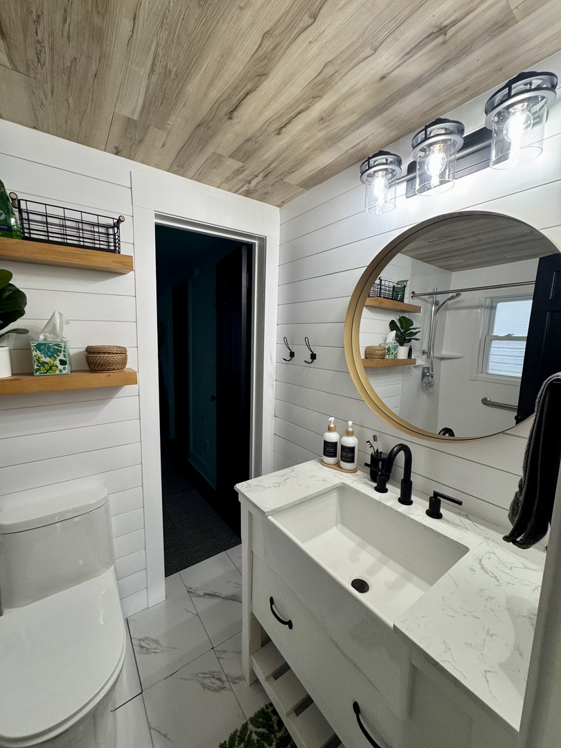 108 West Washington Street Dover, IL 61323 - Photo 24 of 28 a bathroom with a sink and a mirror