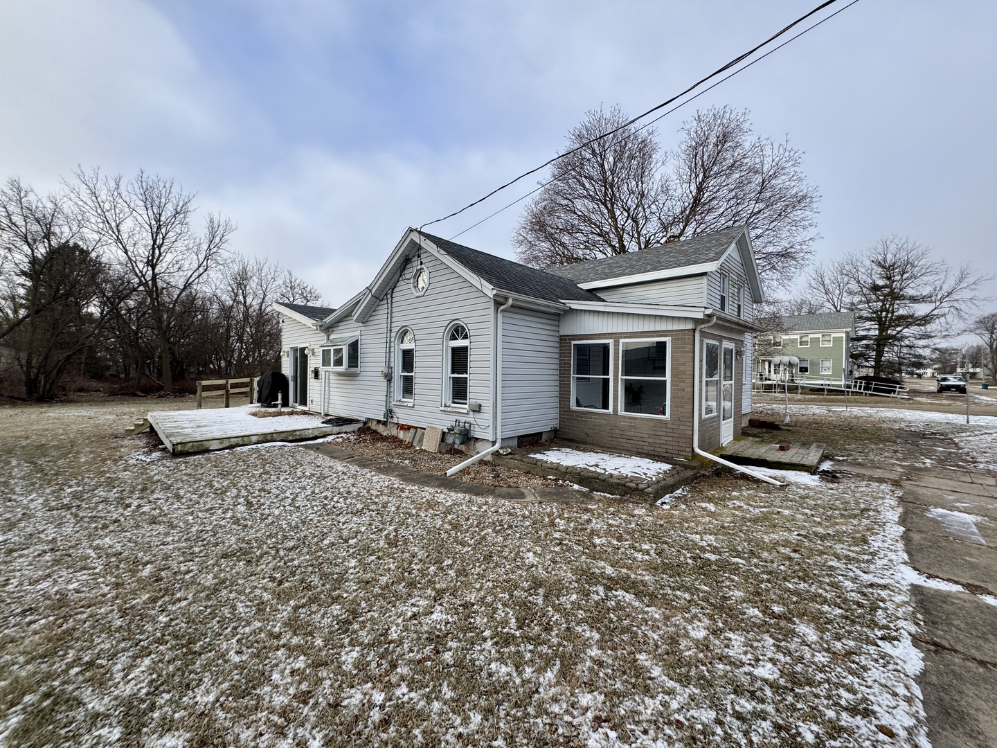 108 West Washington Street Dover, IL 61323 - Photo 28 of 28 a view of a house with a yard covered in snow